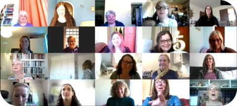 Screenshot of our ladies (on Zoom) at our 5th anniversary celebration including a cake with a candle shaped as a number 5!