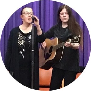 Karen and Sheena performing on stage