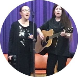 Karen and Sheena performing on stage