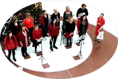 A group of our ladies singing at Braehead Shopping Centre, Glasgow