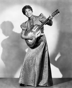 Sister Rosetta Tharpe playing her guitar