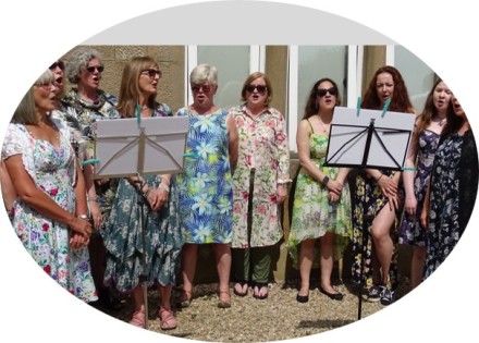 Group of our ladies singing at the Strawberry Tea Event